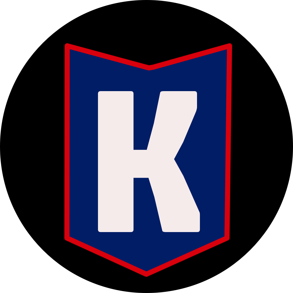 K in a blue badge